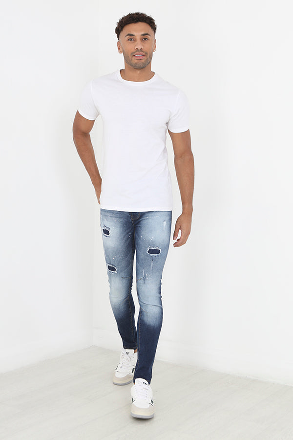 Rip And Repair Patch Paint Splat Skinny Jeans